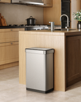 EKO Trash Can next to a modern kitchen counter, surrounded by light wood cabinetry and appliances.