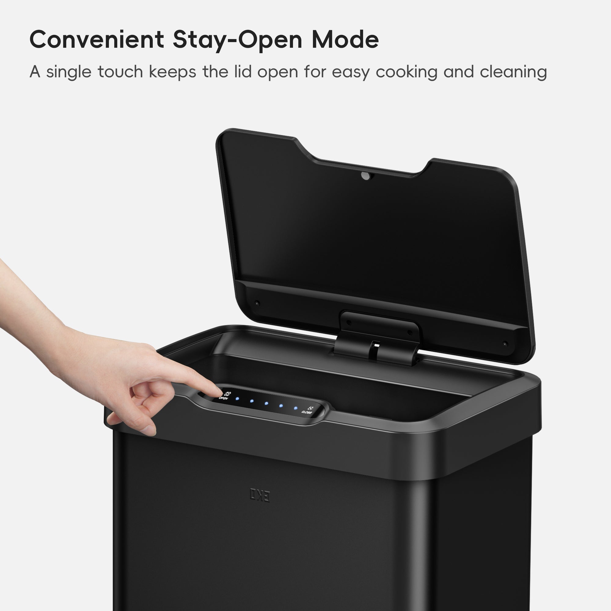 EKO Trash Can with open lid and hand pressing the "Stay Open Mode" button.