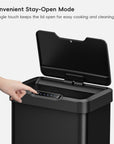 EKO Trash Can with open lid and hand pressing the "Stay Open Mode" button.